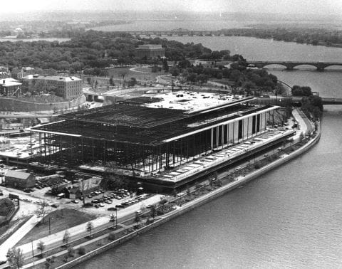 The John F. Kennedy Center for the Performing Arts, half completed, viewed at an angle from above.