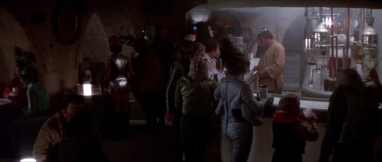 The famous, dimly lit bar, with sundry aliens being served.