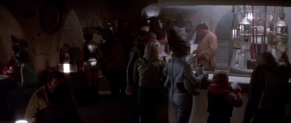 The famous, dimly lit bar, with sundry aliens being served.